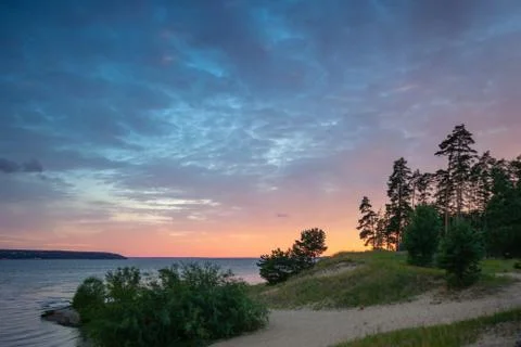 The orange sunset sky on the wide river Stock Photos