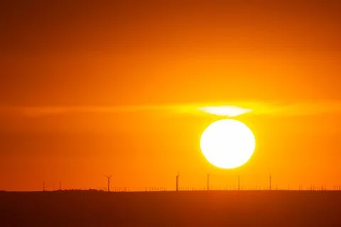 Orange sunset, the sun sets over the horizon Stock Photos