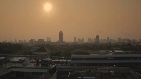Orange sunset through pollution in Bangkok Thailand Stock Footage 89055385