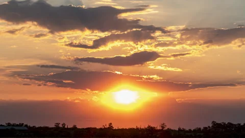 Orange Sunset, Time Lapse of Bright Red Sunset Sun Moving Across Cloudy Sky.. Stock Footage 345081907
