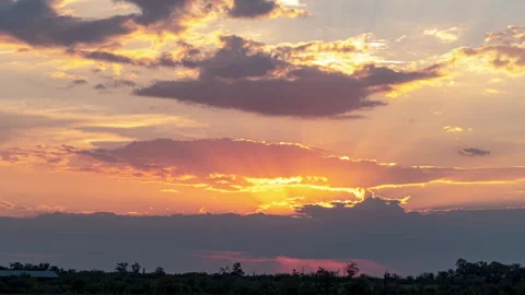 Orange Sunset, Time Lapse of Bright Red Sunset Sun Moving Across Cloudy Sky.. Stock Footage 345118827