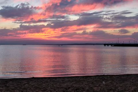 Orange sunset on the water. Stock Photos