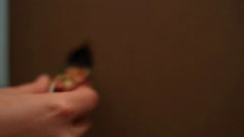 Orange tabby house cat inside a cardboard box peeking out the "door" flap. 스톡 동영상 88417906