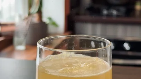 Orange tablet dissolving in water with fizzy bubbling effect Stock Footage 306531225