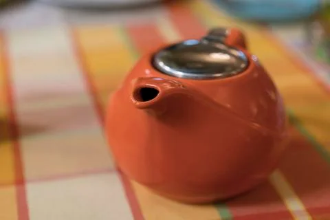 Orange teapot Stock Photos