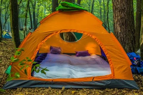 Orange tent in forest Stock Photos