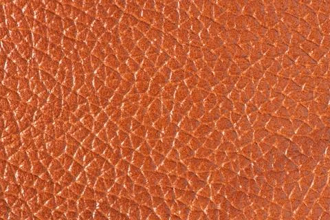 Orange textured leather background Stock Photos