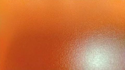 Orange Textured Surface with Subtle Light Reflection. Stock Photos