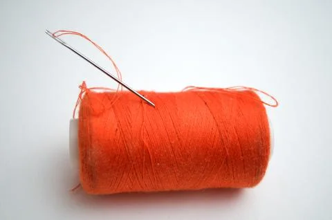 The orange thread with a needle Stock Photos