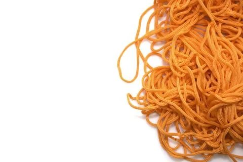Orange thread on a white background close-up Stock Photos