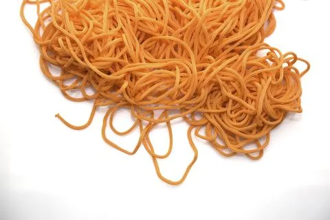Orange thread on a white background close-up Stock Photos