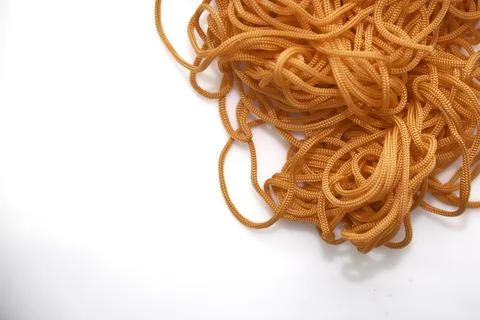 Orange thread on a white background close-up Foto stock