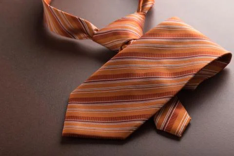 Orange tie on table Foto stock