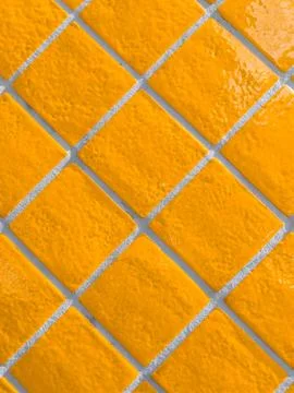 Orange tiled wall pattern with textured glazed surface Stock Photos