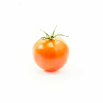 Orange tomato with green leaf Stock Photos