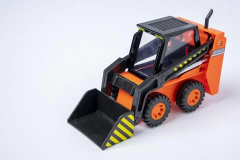 Orange Toy Loader on white background, Mini Loader, Toy Industrial Car Stock Photos