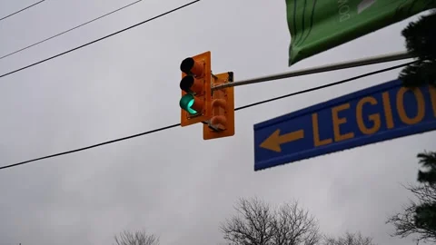 Orange Traffic Light Illuminates Green Light Over an Intersection in Whitby Stock Footage 330914885
