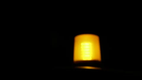 Orange Traffic Warning Light flashing in the dark night. Orange Emergency Strobe 動画素材 131073369