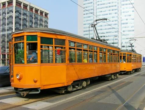 Orange trams in Milan Stock-Fotos