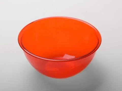 Orange transparent plastic deep dish, isolated on white background Stock Photos