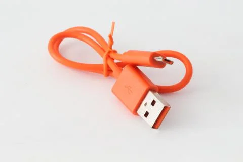 Orange USB cable on white background. Fotos Stock