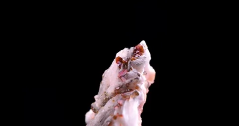 Orange vanadinite on baryte rotating Stock Footage 253565594