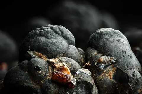 Orange vanadinite on hematite Stock Photos