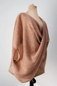 Orange vest knitted in thread. Handmade garment Stock Photos