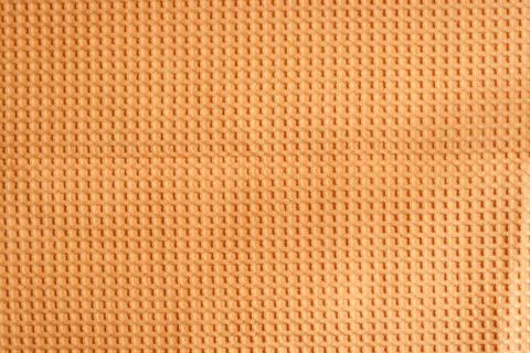 Orange waffle patterned fabric Stock Photos