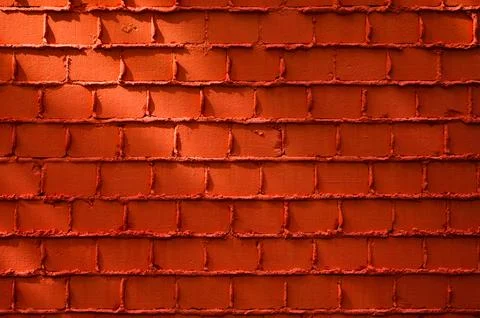 Orange wall and rays of light close-up.. Stock Photos