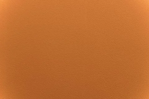 Orange wall with plaster background. Surface with texture and grain. Finishing Stock Photos