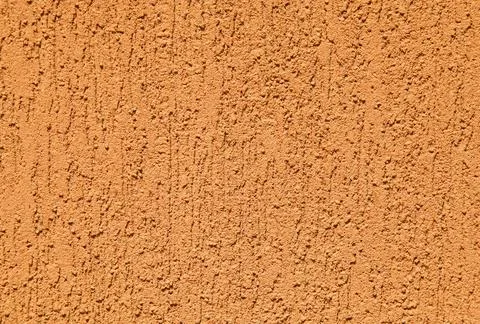 Orange wall, texture, background. Plastered building wall. Rough surface Foto stock