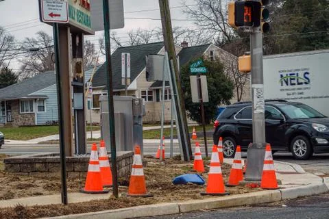 Orange warning cones at sidewalk construction site Stock Photos