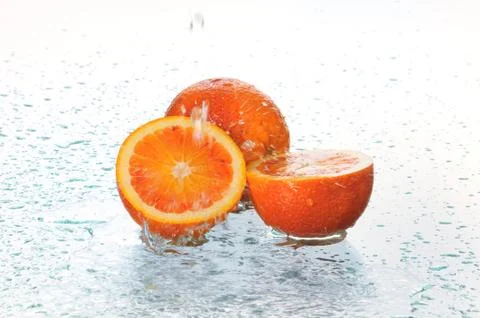 Orange in water Stock Photos