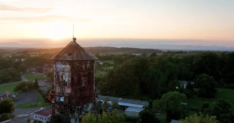 Orange water tower at sunset Stock Footage 272331141