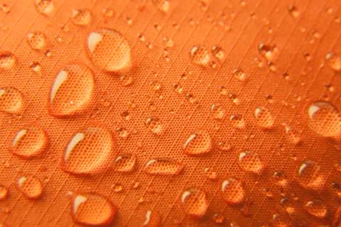 Orange waterproof textile background Stock Photos