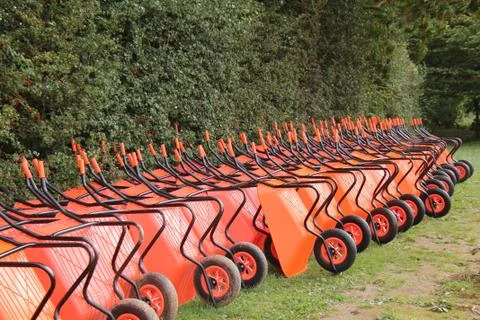 Orange Wheelbarrow. Stock Photos