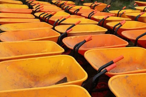 Orange Wheelbarrow. Stock Photos