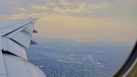 Orange wildfires smoke as viewed over NYC from an airplane window Stock Footage 243375152