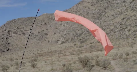 Orange Wind Sock Blowing in the Wind Albuquerque NM Foothills Stock Footage 329401420