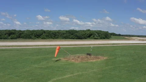 Orange Wind Sock at Small Airfield Drone Arc Stock Footage 268773297