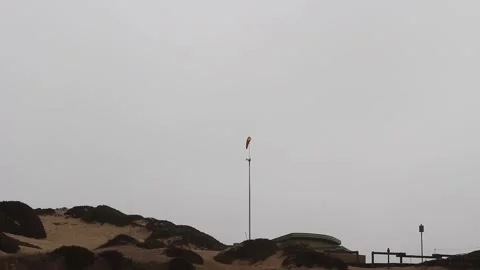 Orange Windsock And Sand Dune Overcast Sky Stock Footage 342765868