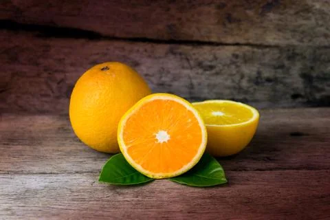 Orange on a wooden table. Selective focus. Stock Photos