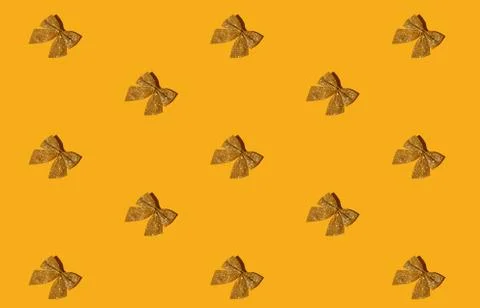 Orange xmas background seamless pattern gold bow Stock Photos