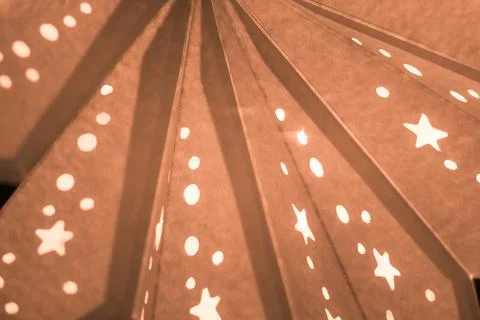 Orange xmas lantern star pattern at christmas market season. Shiny star mood  Stock Photos
