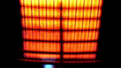  orange &amp; yellow ceramic radiant panels on gas heater with shimmering heat Vidéo 79952676