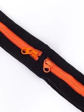 Orange zipper pull close-up Stock Photos