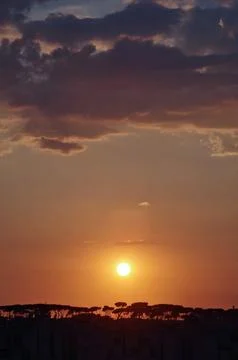 Oranged sunset with clouds Stock Photos
