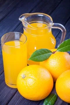 Oranges and juice on the table rustic still life Stock Photos