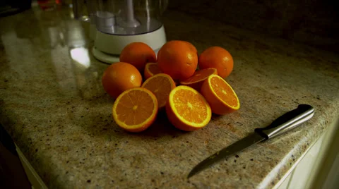 Oranges and Juicer on Counter Stock Footage 35224679